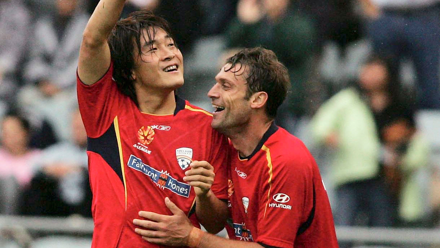 Shenqing Qu celebrates his chip against Brisbane in 2006