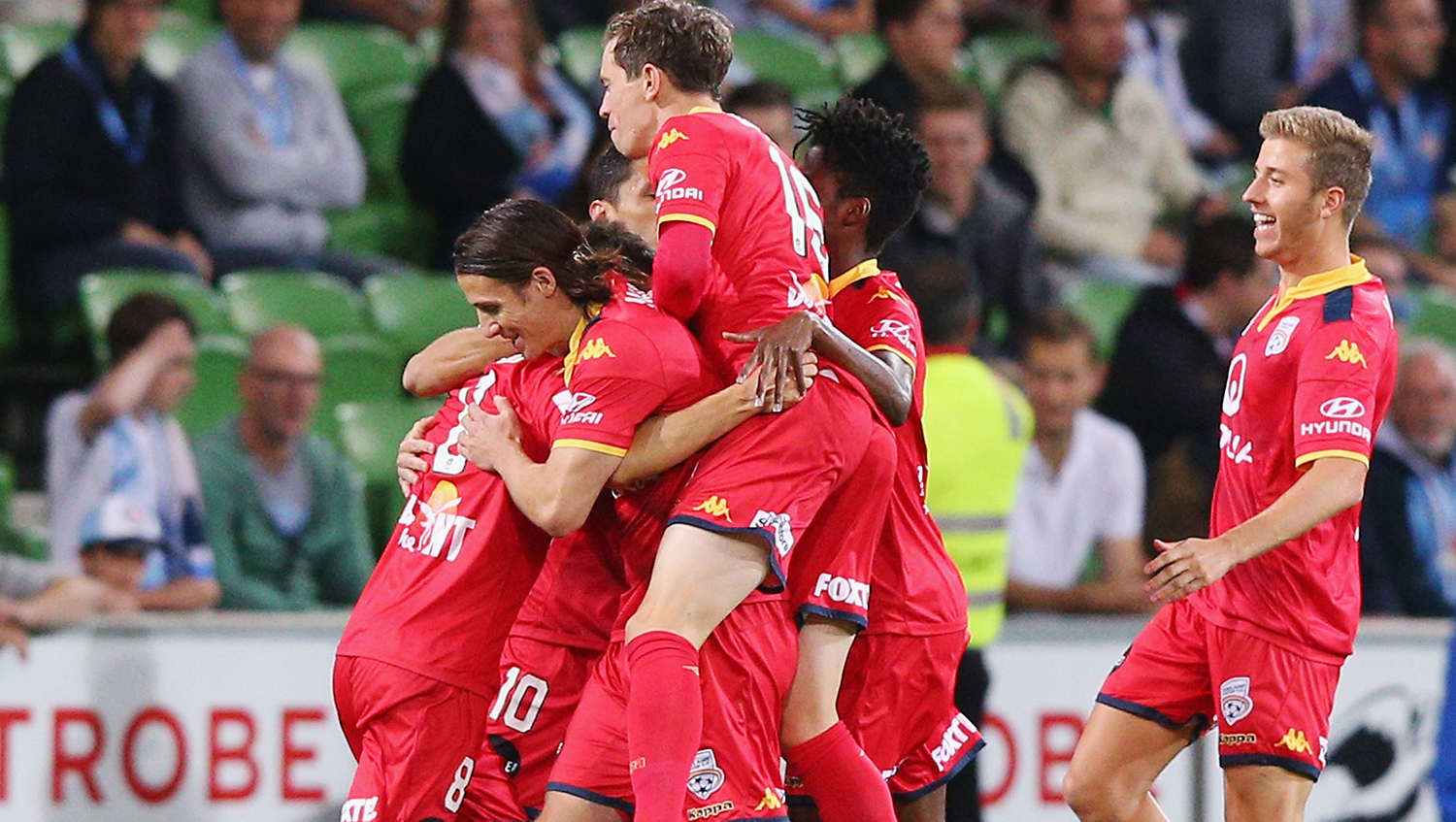 AUFC players celebrate scoring against Melbourne City in 2016