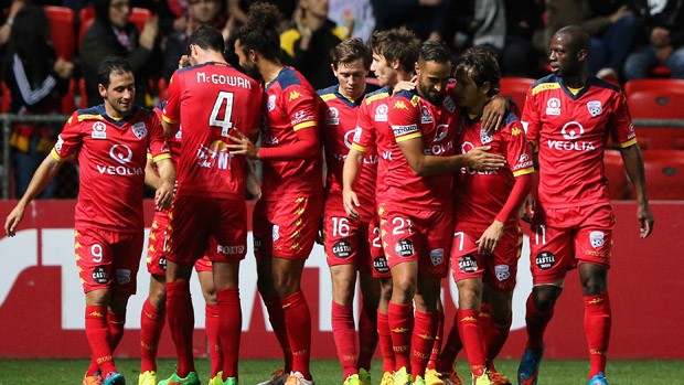 Reds players celebrate a goal in their 4-1 win over Melbourne City FC.