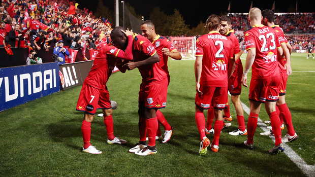 Adelaide United players celebrate following their 4-1 win over Melbourne City.