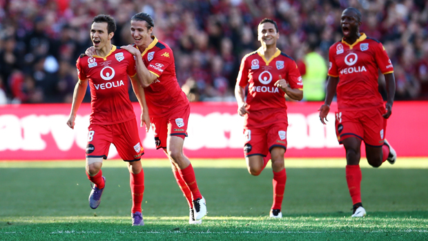 Adelaide United players celebrate Isaias' first half goal against Western Sydney Wanderers.