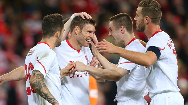 Liverpool players celebrate James Milner's second half goal against Brisbane Roar.