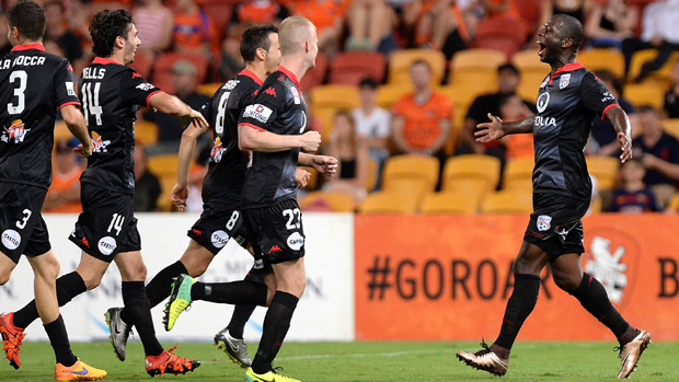 Bruce Djite celebrates with teammates after scoring in his side's 3-1 win over the Roar.
