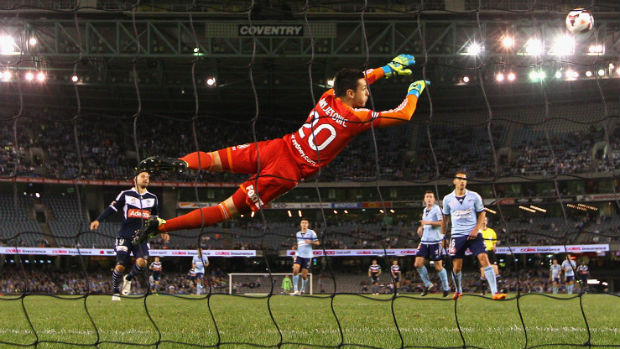Sydney FC goalkeeper Vedran Janjetovic takes flight against Victory last season.