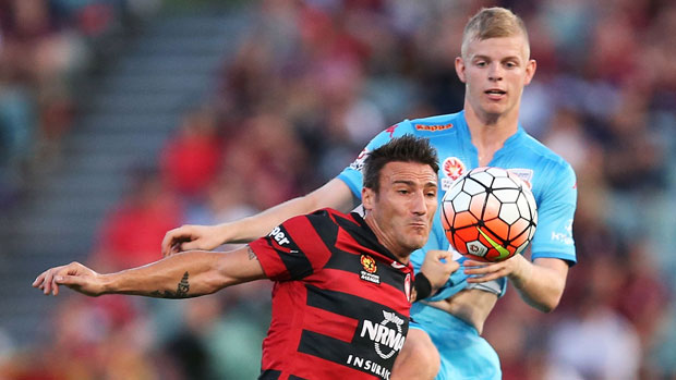 Wanderers striker Federico Povaccari holds off Adelaide youngster Jordan Elsey.