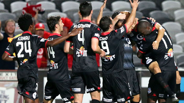 Adelaide United players celebrate Bruce Djite's second-half goal against the Mariners.