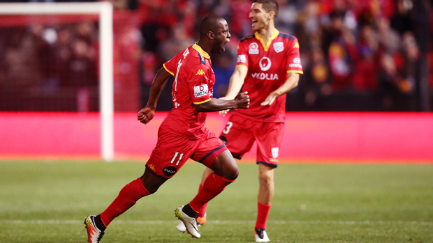 Reds striker Bruce Djite celebrates after scoring in his side's win over Melbourne City.