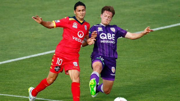 Marcelo Carrusca and Chris Harold tangle for the ball in the first half at nib Stadium.