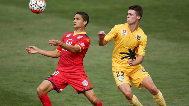 Reds playmaker Marcelo Carrusca controls the ball on his chest ahead of Mariners defender Jake McGing.