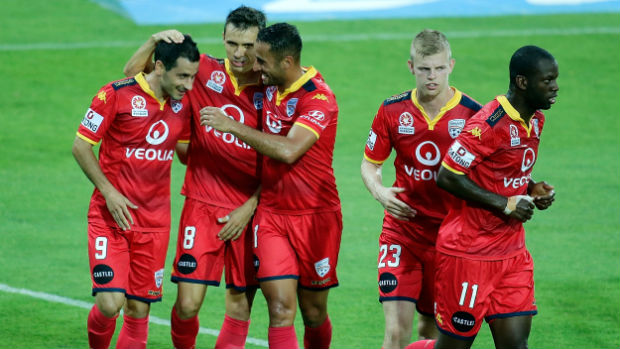 Adelaide United players celebrate Sergio Cirio's goal against Glory at nib Stadium.