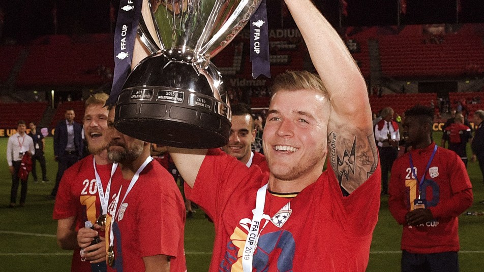 Riley McGree celebrates with the FFA Cup in 2019
