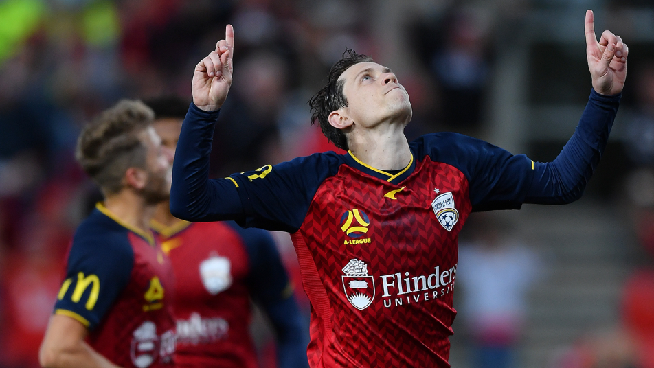 Craig Goodwin celebrates after scoring a penalty against Sydney FC