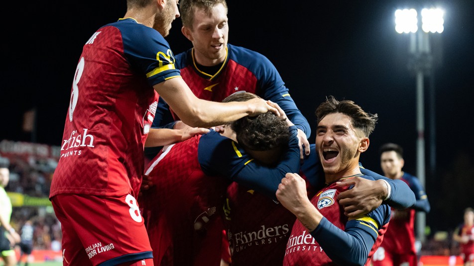 Adelaide United celebrate Craig Goodwin's goal vs Brisbane Roar