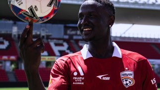 Getting to Know Ajak Riak: A Warm Welcome in Red