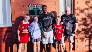 Dukuly surprises young Reds fans with special backyard visit