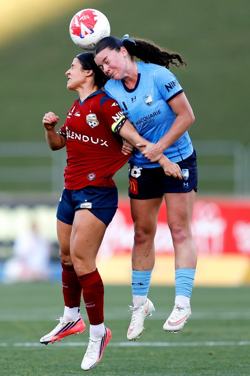 Kenzie Roling of Sydney FC competes with Adriana Taranto of Adelaide United at Sydney Olympic Park Athletic Centre.