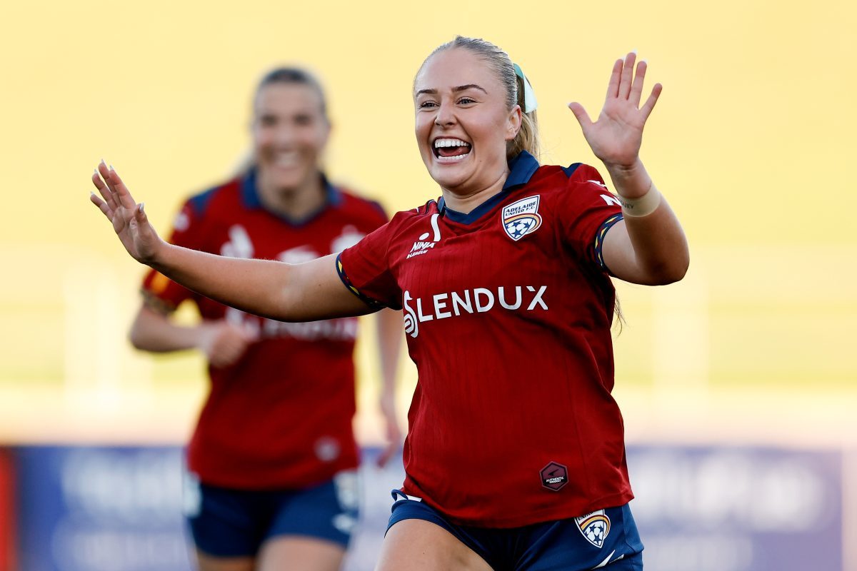 Lara Gooch of Adelaide United celebrates a goal scored by team mate India Breier at Sydney Olympic Park Athletic Centre.