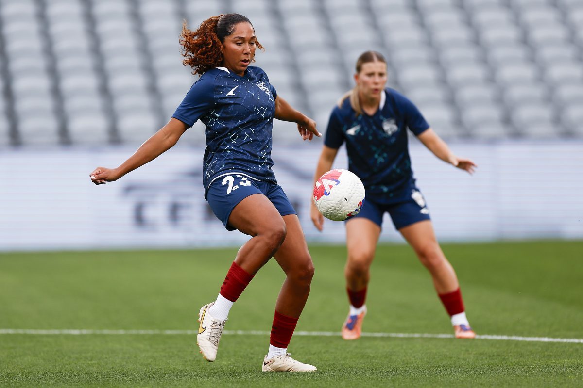 Tianna Harris (L) of Adelaide United warms up before the match at Polytec Stadium.