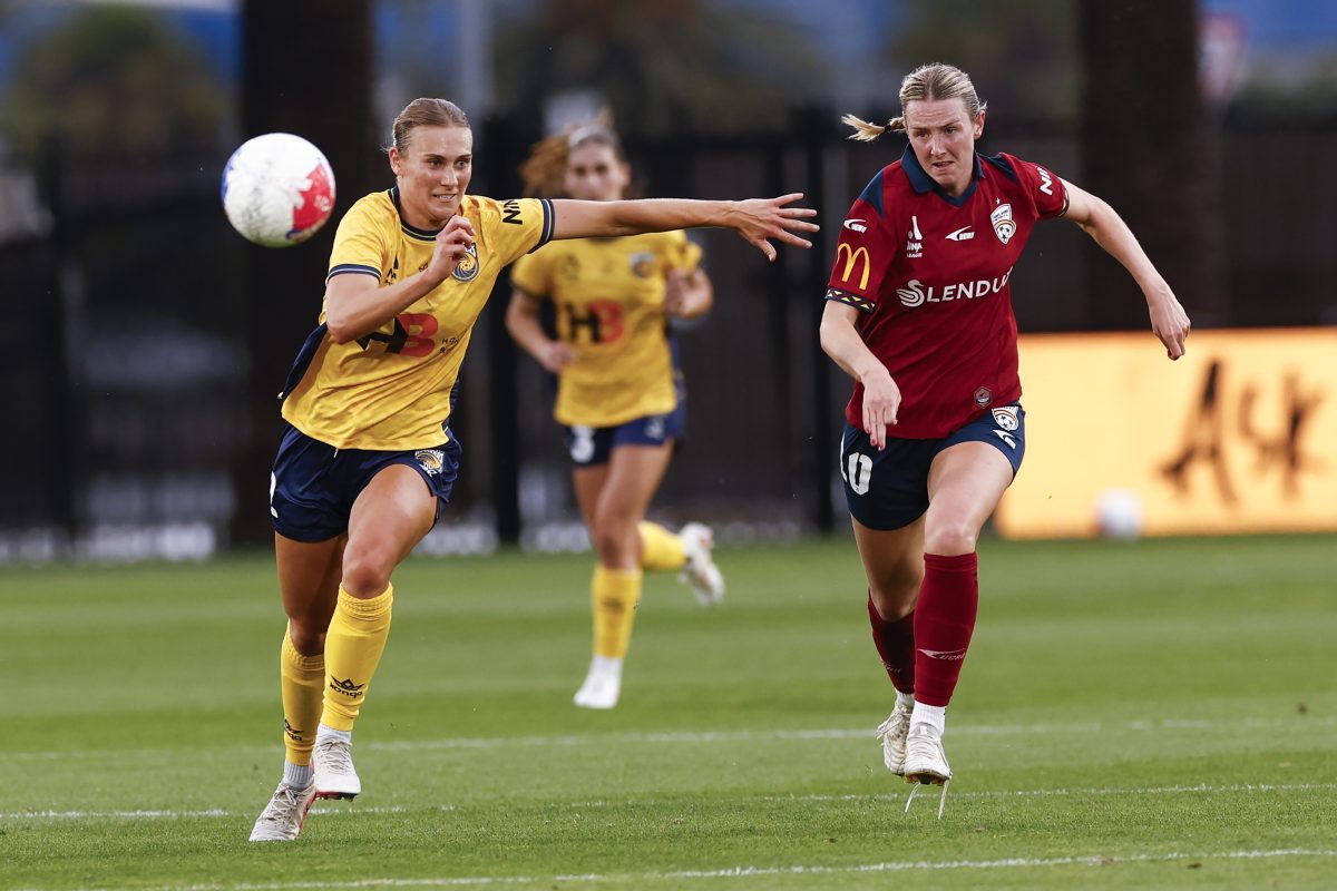 Rebecca Lake (L) of the Mariners and Chelsie Dawber (R) of Adelaide United compete for the ball at Polytec Stadium.