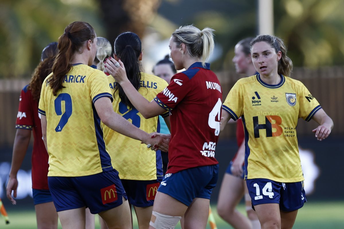 Skye Halmarick of the Mariners and Holly Murray of Adelaide United shake hands after the match at Polytec Stadium.
