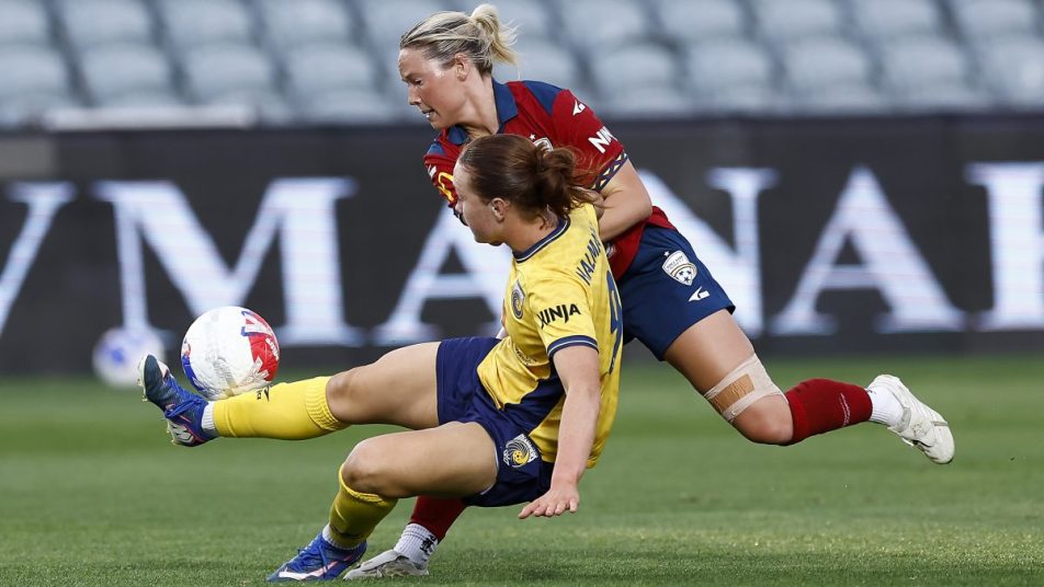 Skye Halmarick (L) of the Mariners and Holly Murray of Adelaide United compete for the ball at Polytec Stadium.